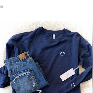 Navy blue smiley face sweatshirt embroidered sleeve NWOT. Sweatshirt only.